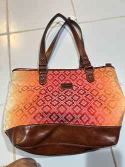 vintage Nine & Co. shoulder tote featuring a vibrant orange-to-red geometric canvas pattern paired with rich brown faux-leather trim.