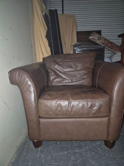 Comfy brown leather chair with ottoman