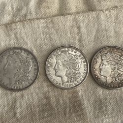AU / UNC Morgan Dollars