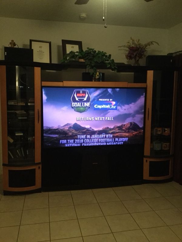 Mitsubishi TV 75” inches with TV cabinet and sound round system