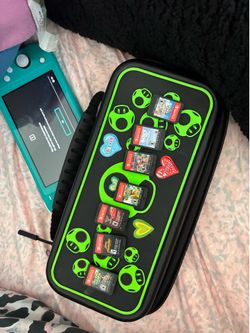 Nintendo Switch Lite – Teal + Case + 7 Games