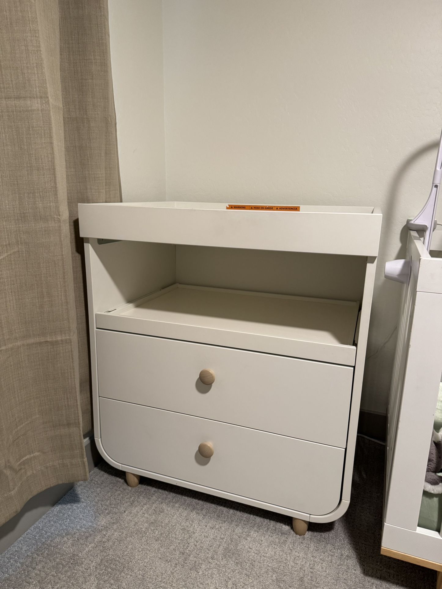 IKEA changing table with large drawers.
