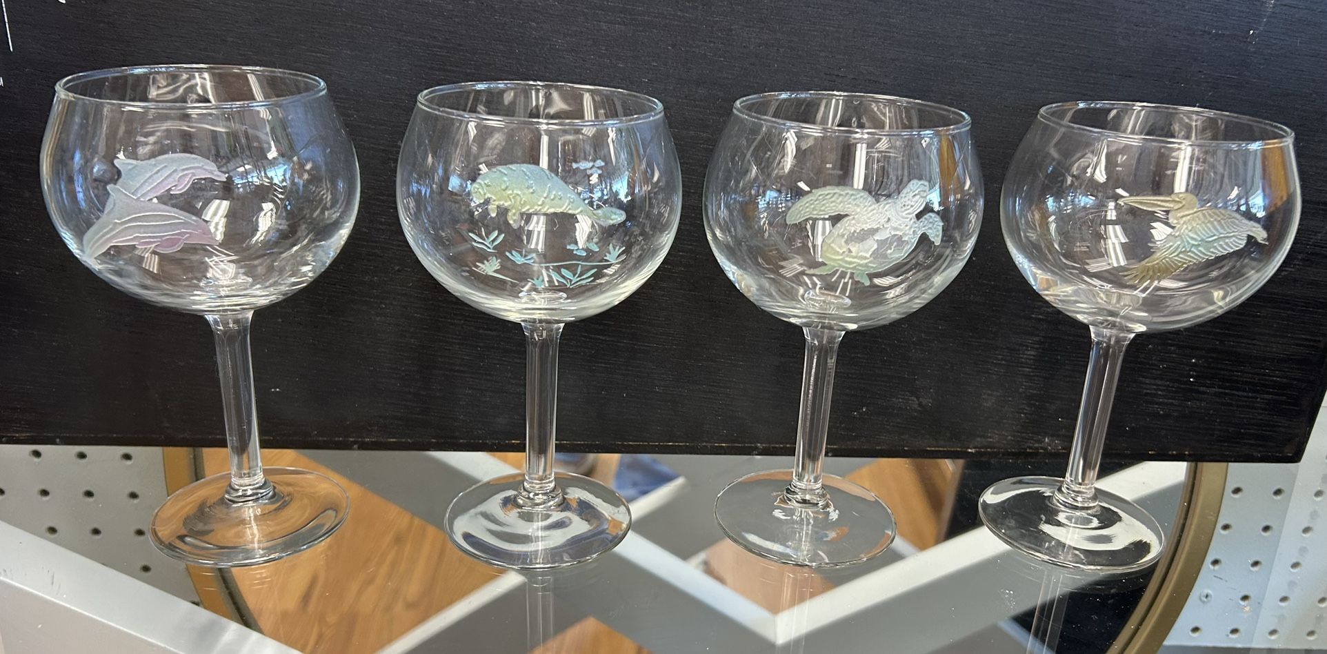 Set of 4 Tropical Etched wine glasses, dolphins, manatee, sea turtle and stork