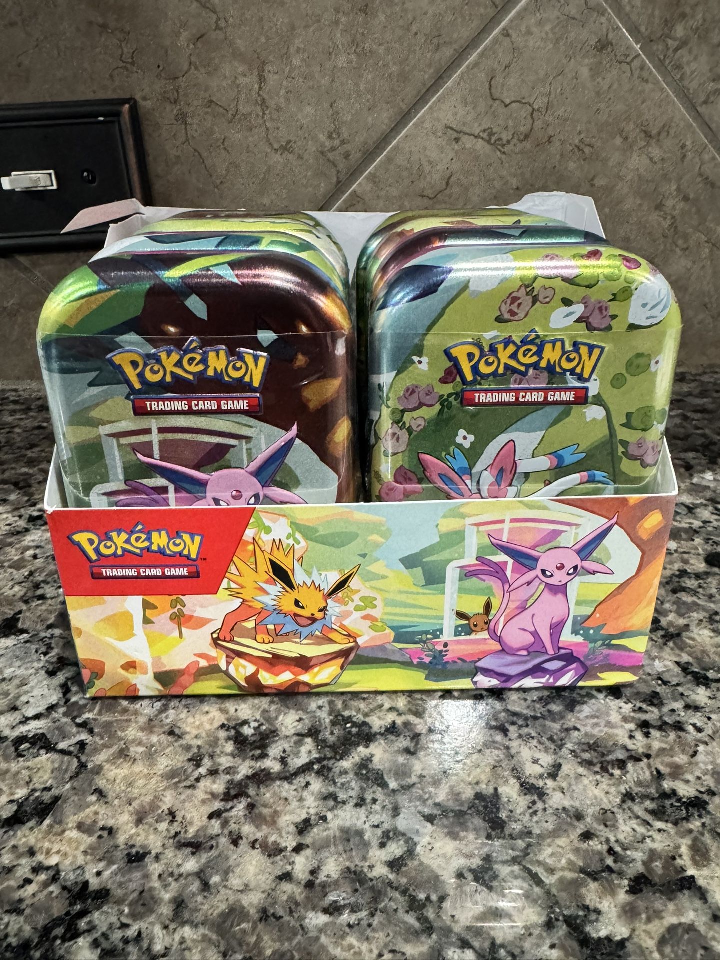 Pokemon Prismatic Tins