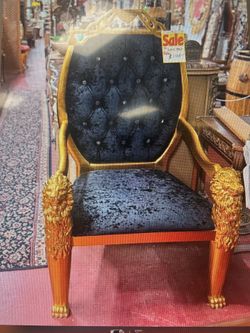 Gold Lion chair with black fabric
