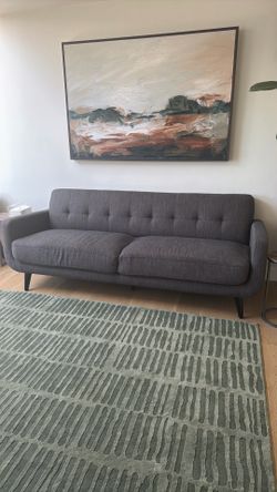 Gray tufted couch