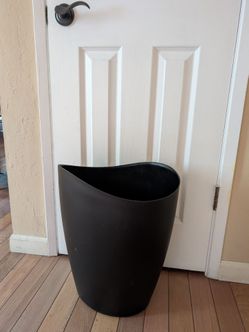 large/oversized black trash garbage can wastebasket bin