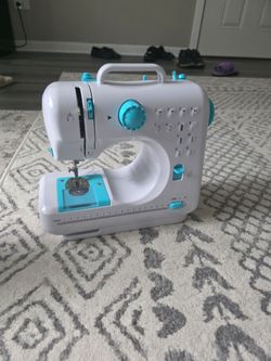 Sewing machine with iron