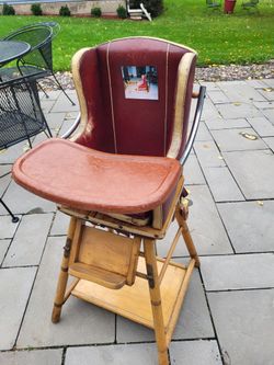 Antique Wearever wooden convertible high chair on rolling base, converts to play desk, reportedly over 95 years old (prior to 1930)