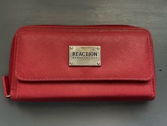 red Kenneth Cole Reaction wallet is a stylish, functional accessory typically priced between $15 and $35 on resale and secondary marketplaces. These w