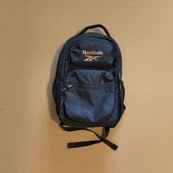 black Reebok backpack with an interior laptop sleeve and multiple pockets. 