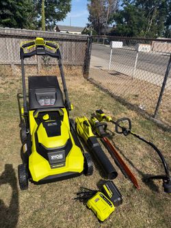 RYOBI 40V  4-Piece Kit featuring a 21-inch Rear-Drive Lawn Mower, Blower, Trimmer, and Hedge Trimmer includes (1) 6Ah Battery and (1) Charger.