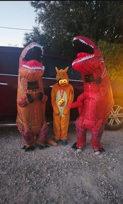 2 inflatable dinosaurs and charizard halloween
