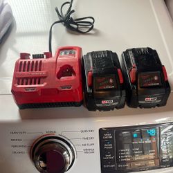 Milwaukee Charger And batteries Good Condition.