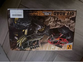 New GUOKAI 2.4GHz radio control off-road truck is model number 886-785B. This 4WD vehicle has a black and yellow color scheme with a rugged rock crawl