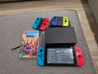 Nintendo Switch, 3 joy cons, and Spyro