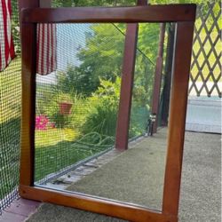 Mid - century heavy maple mirror. Made by “Famous Reproductions of Old New England Furniture “