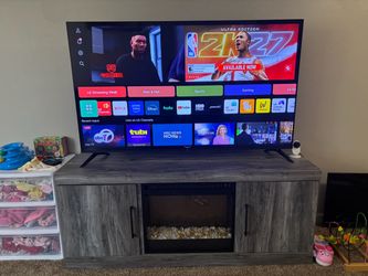 65” LG 4K Smart TV + Ashley Electric Fireplace TV Stand