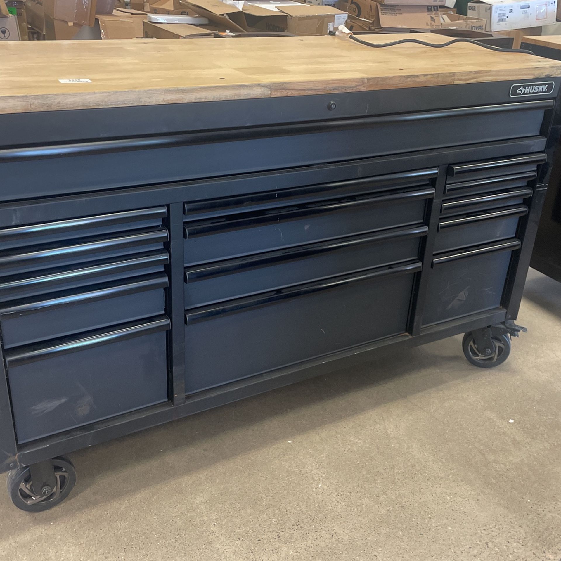 Husky 61 in. W x 23 in. D Heavy Duty 15-Drawer Mobile Workbench Tool Chest with Solid Wood Top in Matte Black