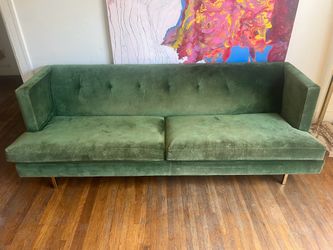 Green velvet CB2 couch