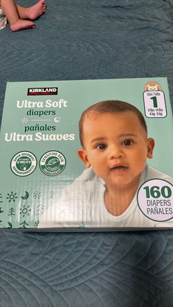 Size 1 diapers and baby carrier