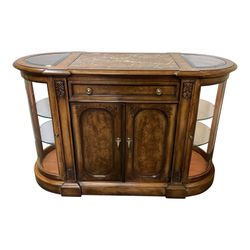 Design Plus Gallery presents a Amalfi Server from Henredon. Beautiful Burlwood encases this elegant and functional piece. A lovely oval shape provides