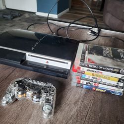 Playstation 3 with clear controller and 7 games