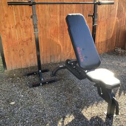 Ethos Heavy Duty Adjustable Bench With A Pair Of Squat Stands And A 6’ Olympic Barbell 