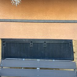 Rear tailgate cover for a pickup truck; it measures 64 inches in length and 19 1/2 inches in width.