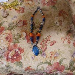 Beautiful orange and blue necklace with silver beads in between