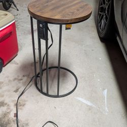 Round End Table with charging ports and slides under sofa 