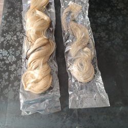 New unused.  2 hair extensions without Click.  Blond hair