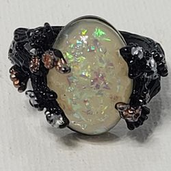 Unique Black Setting With Opulescent Oval Stone