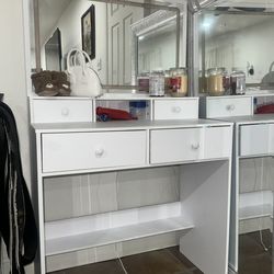 White vanity with light up mirror and storage vanity chair