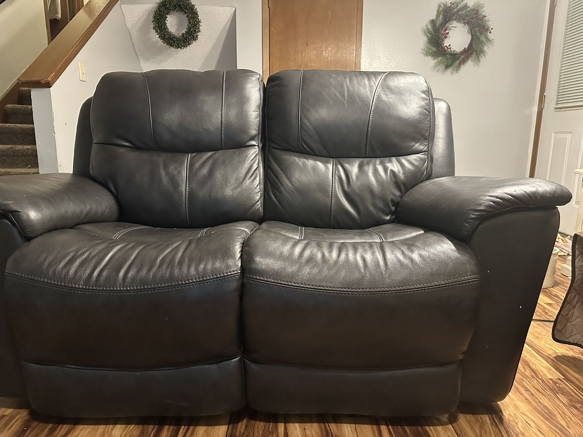 Black leather loveseat, electrical recliner