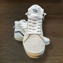 Vans Sk8-Hi sneakers in a white colorway with a black side stripe