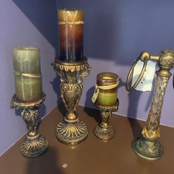 3 candles and a hand towel rack