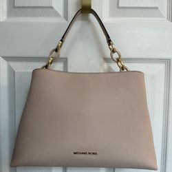 MKors pink saffiano leather handbag with gold hardware.