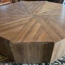 octagonal wooden coffee table with a radial veneer pattern