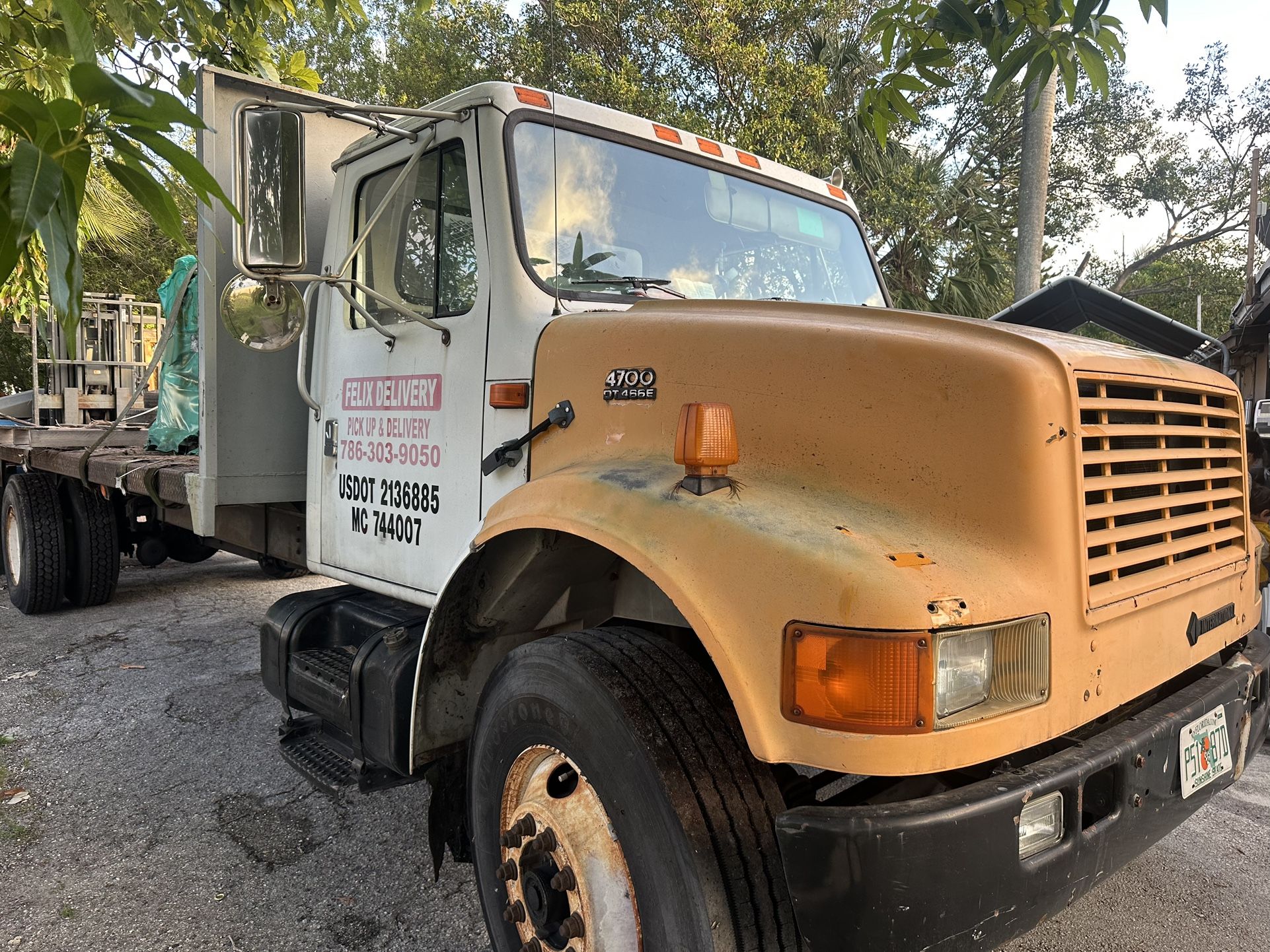 1998 International 4700 Flatbed Truck With Forklifting 