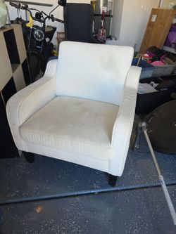 2 light beige accent chairs with navy covers