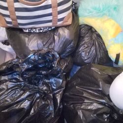 A Lot Of Bags Of Like New Clothes 