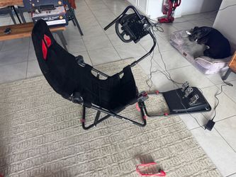 Racing sim gaming chair with steering wheel and pedals