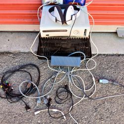 Sony XBox 360 console.3 controllers.AC adapter.Headphones and cables & 7 used games.
