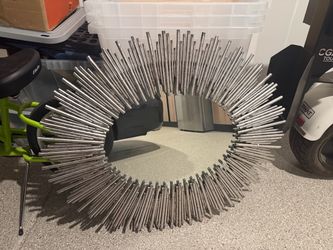 Mirror with steel bar border
