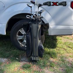 Golf Clubs With Balls And Tees