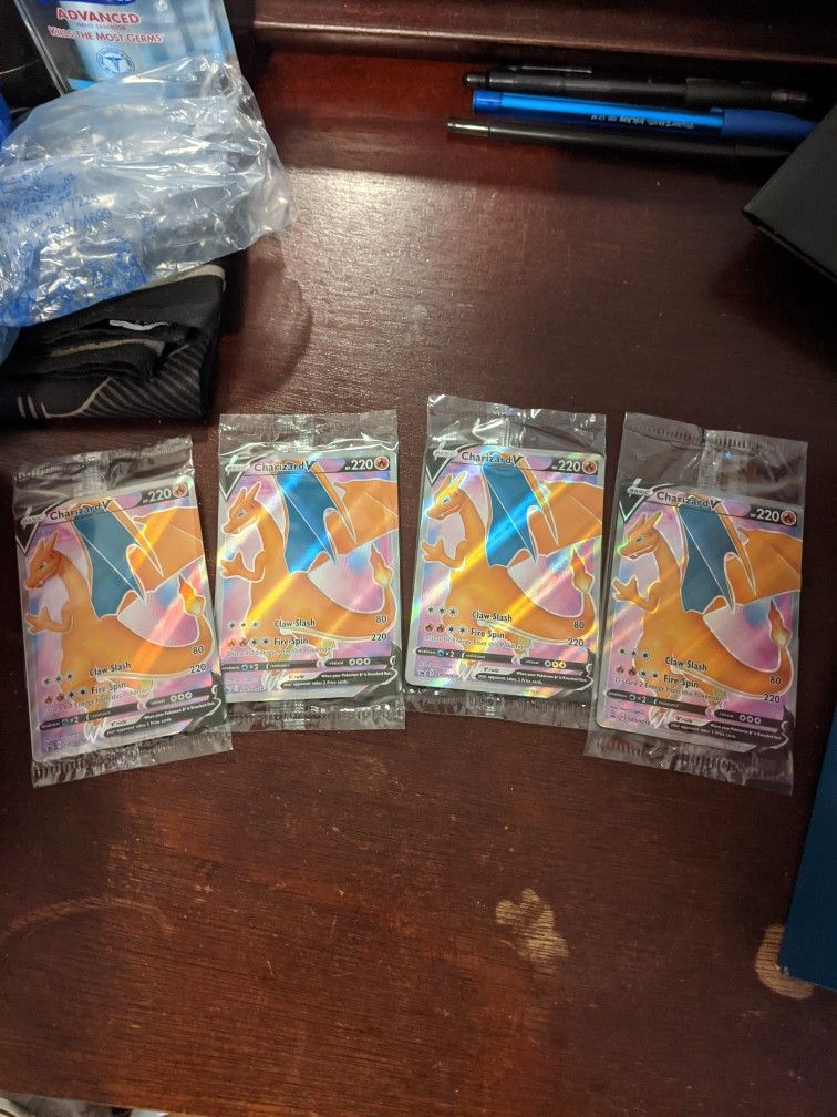 Sealed Charizard V full arts.