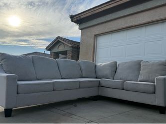 Sectional L shaped couch. Linen Pottery Barn