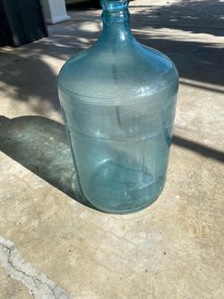 5 gallon old blue glass water bottle