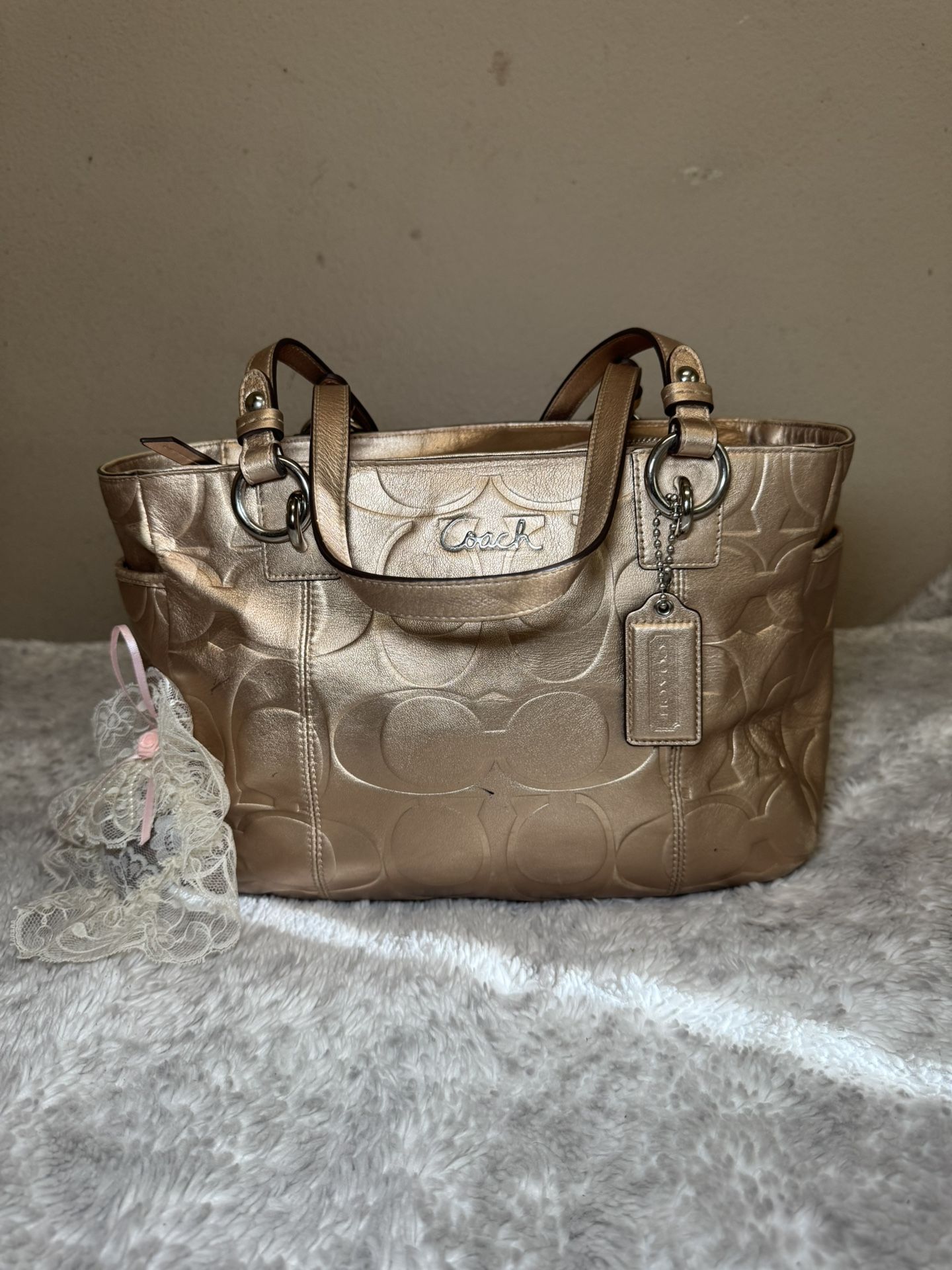 Coach Gold Signature Embossed Leather Bag